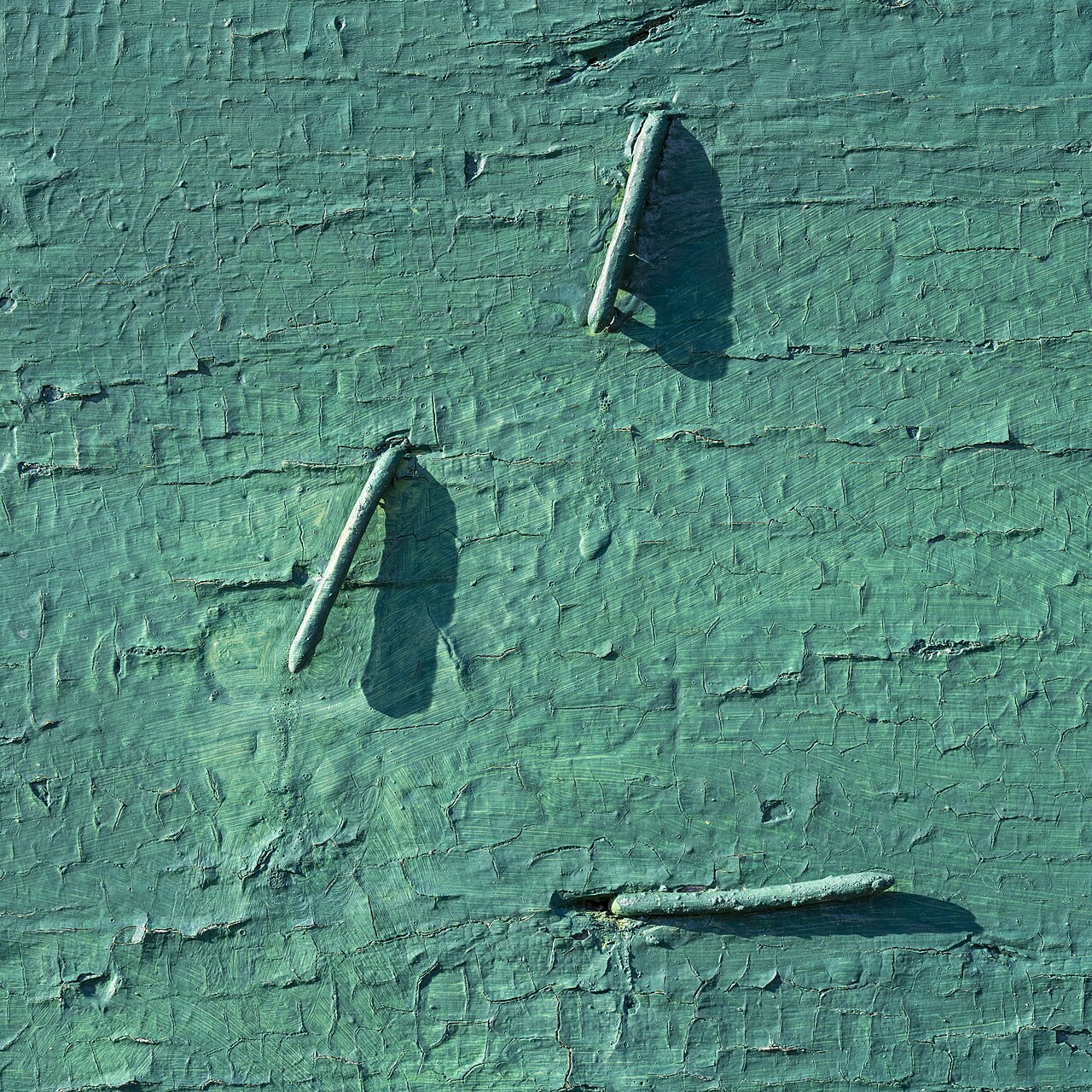Bent nails in green