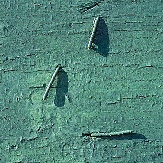 Bent nails in green
