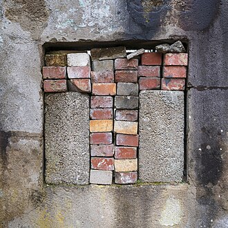 T (bricked-up window